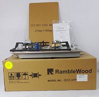 Cooktop displayed on original RambleWood box with cut-out size packaging behind, showing model number and accessories on top.