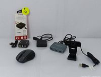 Full lot overview showing all five items: Aukey webcam, Avedio Links HDMI switcher, Xtreme Theater HDMI to AV converter, USB-C card reader, and wireless mouse