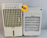 Both Bapole and Oeare portable air coolers side by side showing front vents and touch control panels.