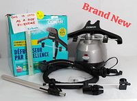 Full lot contents including upright steamer unit, black hanger, steam hose, pole, clips, and product box for brand new Conair CompleteSteam fabric steamer.