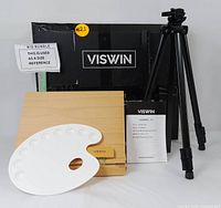 Set contents arranged with the black tripod easel, wooden storage box, white plastic palette, and instruction manual next to the VISWIN box