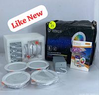 Full kit including five visible 4-inch LED downlights, wiring components, gray power box, original box with branding and manual; lights wrapped in protective plastic.