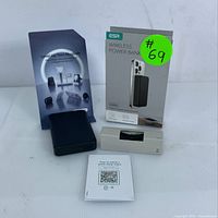 Display of the ESR Wireless Power Bank box, the power bank device, charging cable, and user guide with QR code.