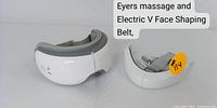 Personal care duo: eye massager and electric V-face shaping belt shown side-by-side with visible controls and padding.