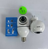 Light bulb style and wall plug style 5G security cameras with setup guide, showing front view with lens and LED lights.