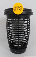 Front view of black cylindrical Palone bug zapper with protective grid and visible high-voltage grid inside, showing Palone logo at base.