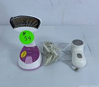 Front view of Reemix steamer and USB fabric shaver showing the steamer's steam plate and cord, and fabric shaver's USB cable.