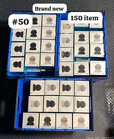 Top view of multiple boxed Mission Battery Bases, showcasing quantity and packaging condition.