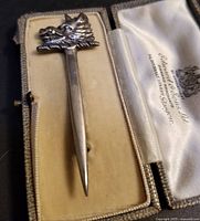 Antique sterling silver Scottish kilt pin with detailed hogs head design in original box.