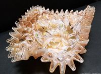 Full view of the glass bride basket showing crimped edges and marbled peach caramel color.