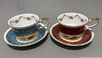 Two vintage Paragon English fine bone china teacup and saucer sets shown side by side, one red and one blue with gold accents.
