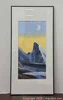 Full view of the narrow framed mountain landscape painting showing the artwork and frame condition.