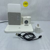 Front view of COLSUR 3-in-1 wireless charging station showing the lamp, alarm clock display, charging base, included USB power adapter and charging cable.