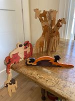 All three wooden animal puzzles displayed on table