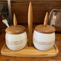 Full set showing two lidded jars on teak tray with spoons