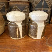 Both ceramic shakers front view showing glaze pattern