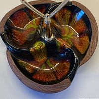 Top view showing three compartments, glaze colors, brass handle