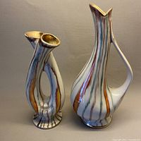 Both striped ceramic vessels side by side