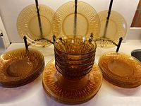 Group view of all plates and bowls arranged to show pattern and quantity