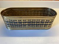 Overall view of brass planter showing basket-weave repousse design