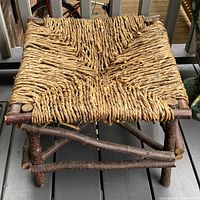 front angled view showing twig frame, woven seat and overall form