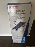 Box packaging of Coleman 40 watt 12 volt crystalline solar panel kit with stand detailing product features in English, French, and Spanish.