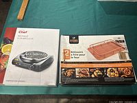 Photo of Master Chef single burner electric cooktop boxed and Kitchen Craft copper roasting tray set boxed