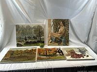 All five oil paintings arranged on white backdrop showing front views