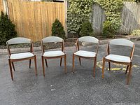Front view of four chairs arranged side by side