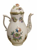 Front view of the coffee pot showing overall shape, lid, handle and spout against a white background.