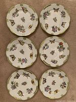 Six plates arranged in two columns of three, top view