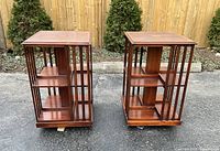 Front view of both revolving bookcase tables side by side