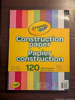 Front view of Crayola construction paper pack with branding and color samples visible
