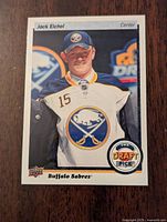 Front image of Jack Eichel Top Draft Choice hockey card showing player in Buffalo Sabres uniform and Top Draft Pick logo.