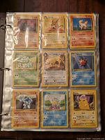 Page of nine cards in top sleeves–Golem, Raichu, Vulpix, Venusaur, Dark Persian, Starmie, Machoke, Seel, Pikachu
