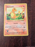 Front of Pokemon Charmander card showing artwork, HP, attacks, and text information