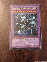 Front of Yu-Gi-Oh Blue-Eyes Ultimate Dragon 1st Edition card showing artwork, text, and stats.