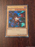 Front of Red-Eyes Black Dragon 1st Edition Yu-Gi-Oh card showing dragon image, stats, text and edition.