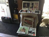 Photo showing several Family Library of Great Music vinyl album covers including Beethoven, Schubert, and Rachmaninoff editions displayed on chairs and floor.