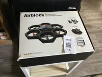 Box showing Makeblock Airblock drone with control by iPhone or tablet app, modular and programmable design features visible on box graphics.