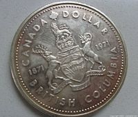 Close-up image of the coin's reverse showing the British Columbia coat of arms and inscriptions including the years 1871 and 1971.