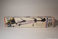 Full view of the Ambico 60" Ultra Light Weight Tripod in its original box, showing tripod folded with packaging.