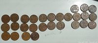Image showing all 32 Canadian pennies arranged in rows, exhibiting the maple leaf reverse side design with clear dates visible such as 1960, 1961.