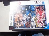 Close up image of Ravensburger puzzle box featuring Star Wars collage and 1500 pieces label