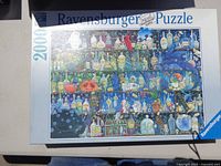 Photo of the Ravensburger 2000 piece puzzle box with Halloween imagery on the cover.