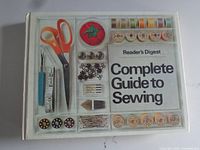 Front cover of the Reader's Digest Complete Guide to Sewing book showing the title and sewing tools illustration.