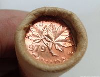 Photo showing the end of a coin roll with a 1979 Canadian penny visible, copper color with maple leaf design.