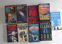 17 Arthur C. Clarke science fiction paperbacks laid flat on marble background, showing first 9 titles.