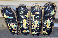 Front view showing all four curved-top wooden panels lined up, displaying colorful hand-painted traditional Asian scenes with figures, pagodas, mountains, floral elements and gold-trimmed borders against a black background.
