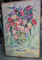Full view of large floral painting on canvas with tulips in a glass vase.